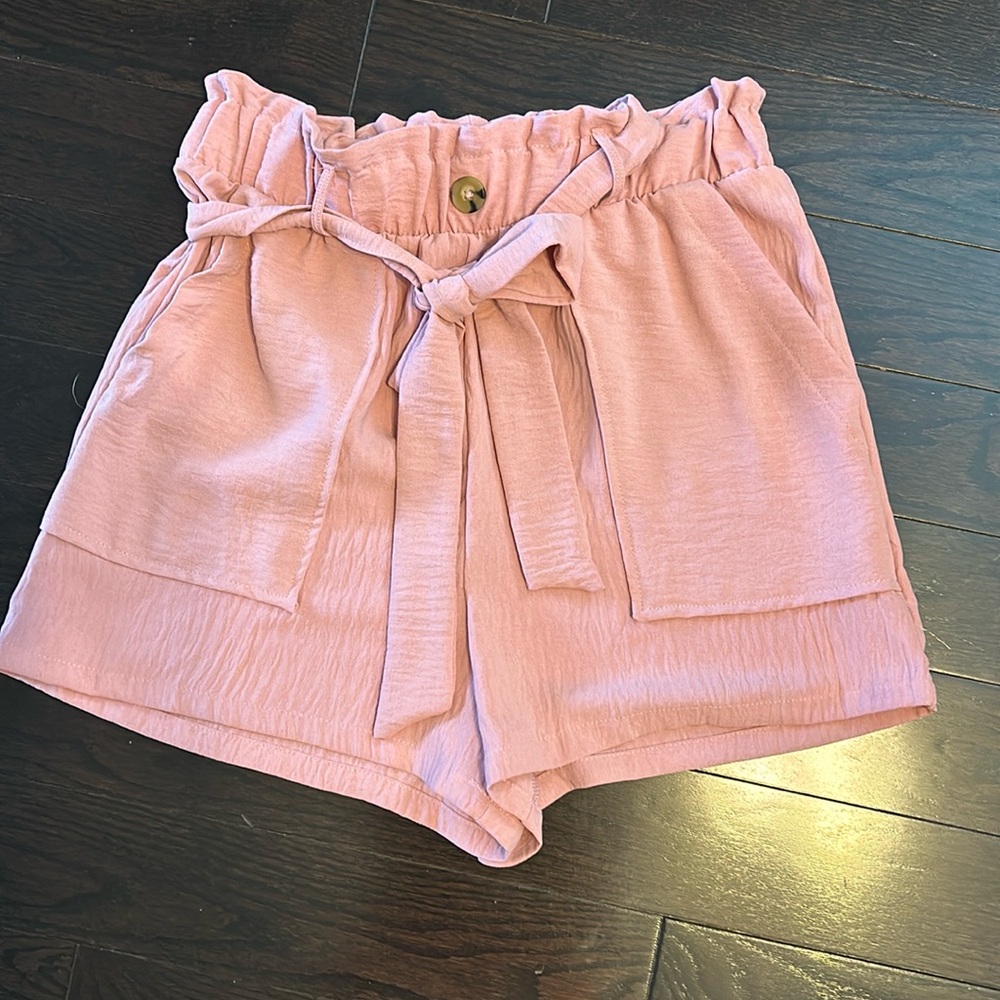 Ladies paper bag style shirts. Elastic waistband and two front pockets.